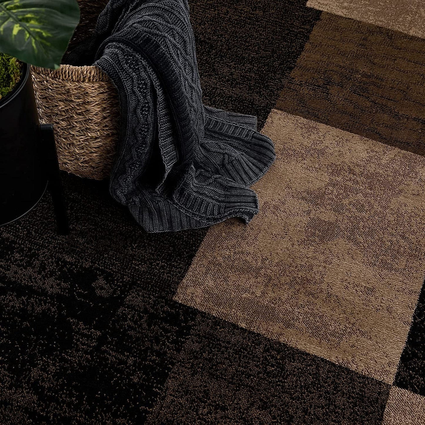 Homeroots geometric shag runner rug in brown and tan checkerboard squares with textured pile beside woven basket and throw