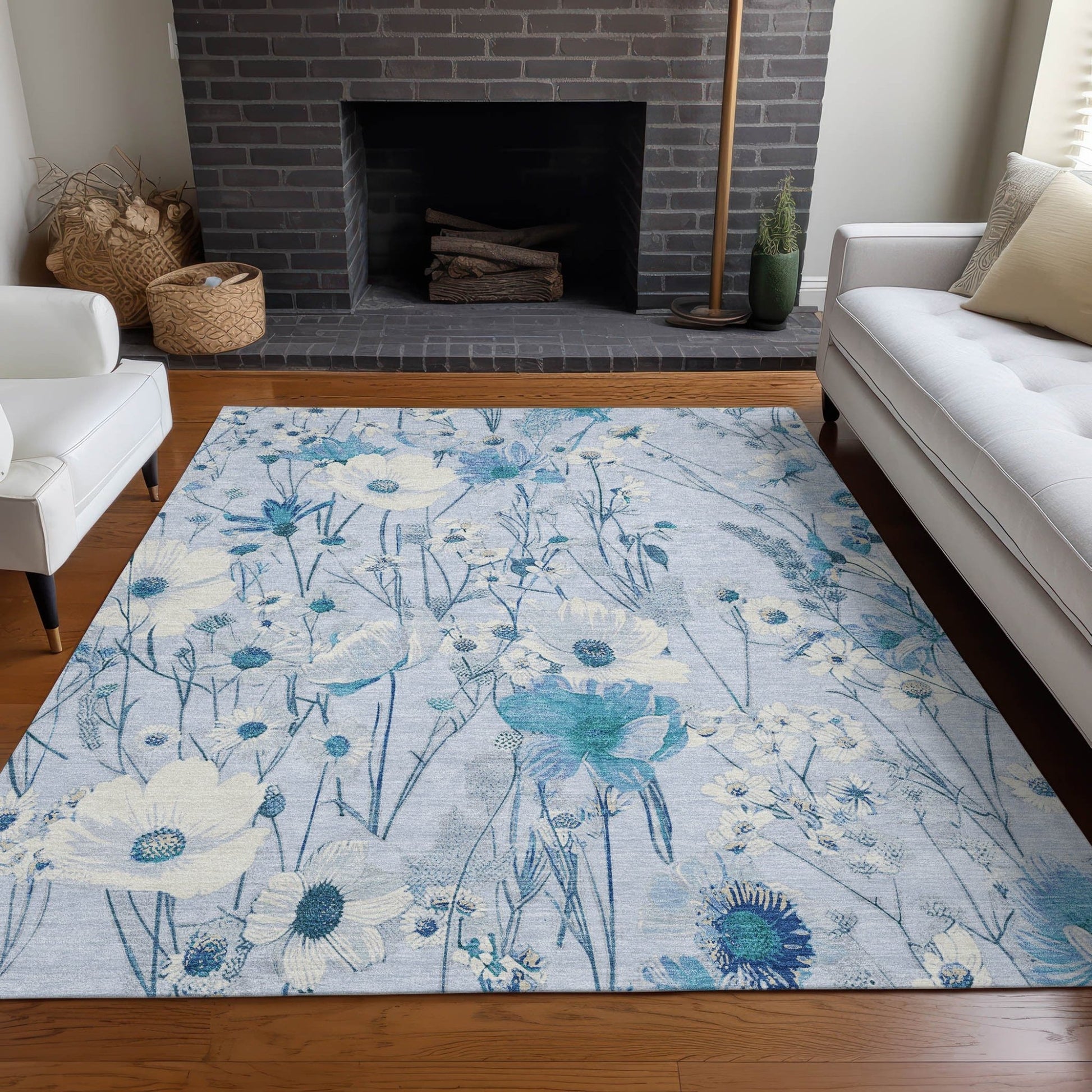 Homeroots sky blue floral washable area rug in living room with large watercolor flowers on hardwood floor