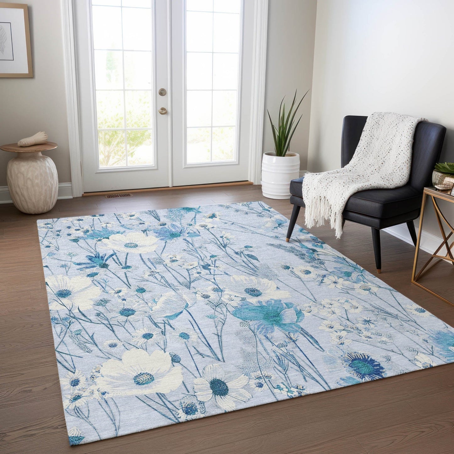 Homeroots sky blue floral washable area rug with watercolor poppies and daisies on hardwood floor