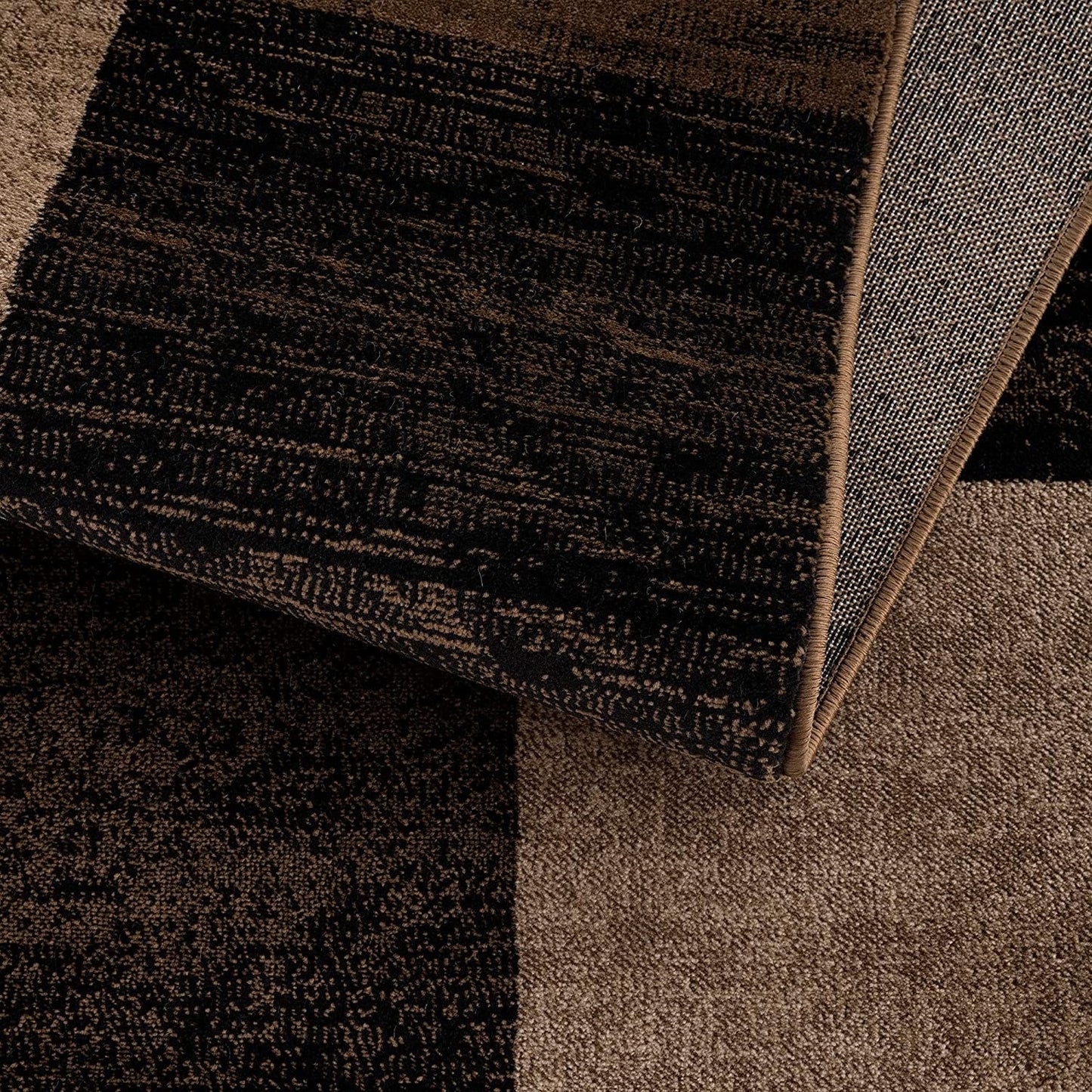 Homeroots geometric shag runner rug close up brown and taupe block pattern with folded corner showing texture and backing