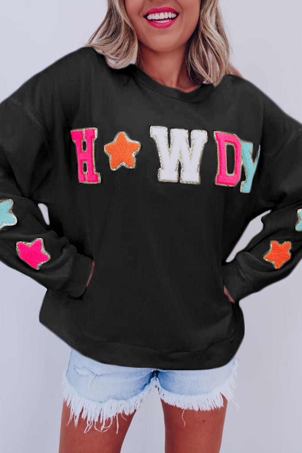 Threaded Pear Howdy patch sweatshirt black cozy oversized top with colorful applique letters and star sleeves